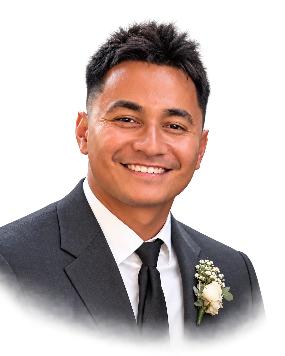 Isaiah smiling in a dark suit